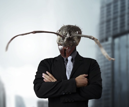 Businessman with ant's head instead of human head